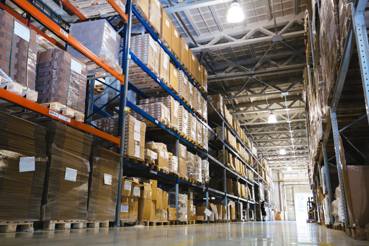 Warehouse shelving stocked with equipment and parts