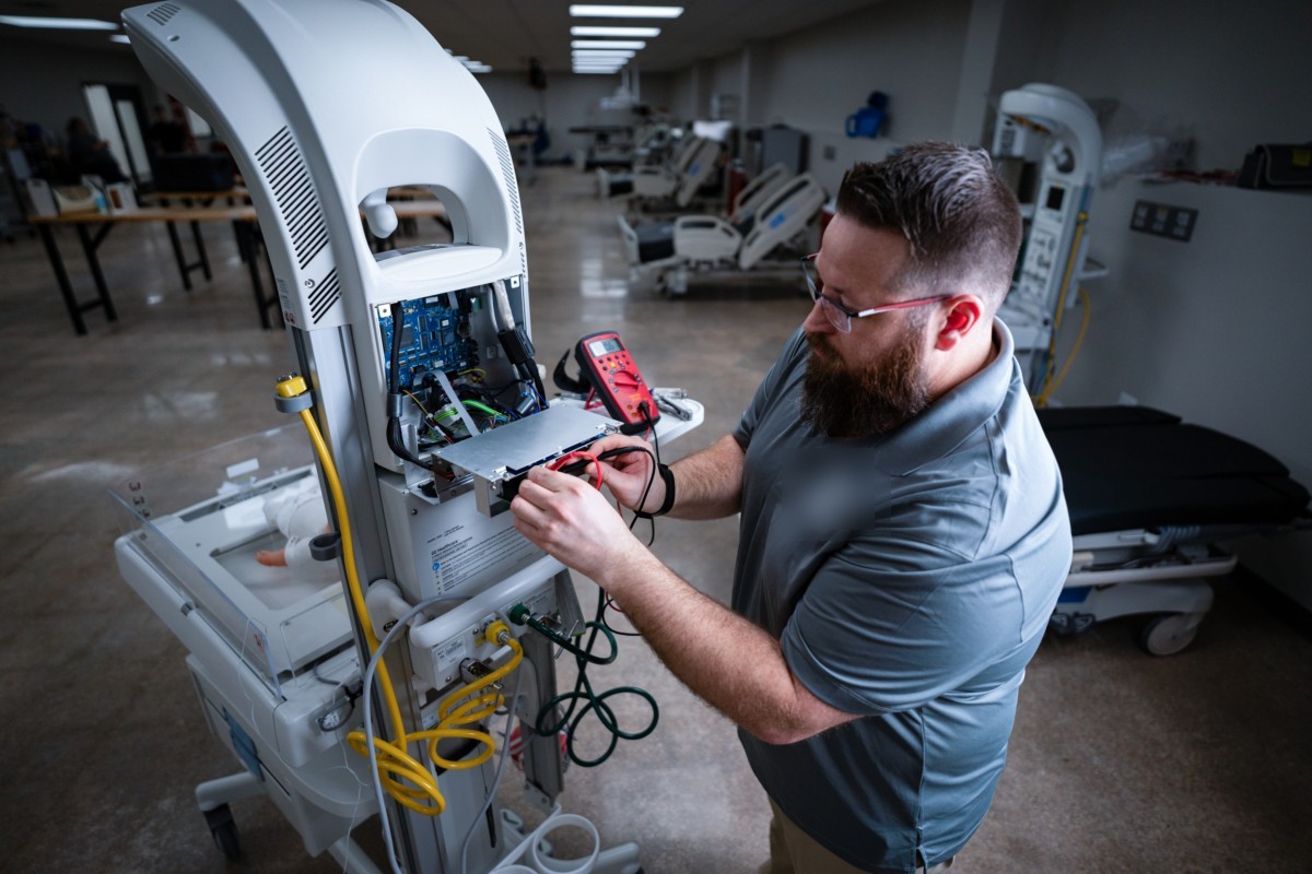 Technician repairing a medical device